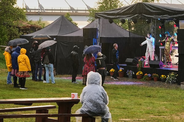 Artists J. Laitinen and Jouni J. perform at the Loktafeasta rap festival in Utsjoki village, north of the Arctic circle, Finland, Sunday, July 6, 2025. (AP Photo/Heli Sivunen)