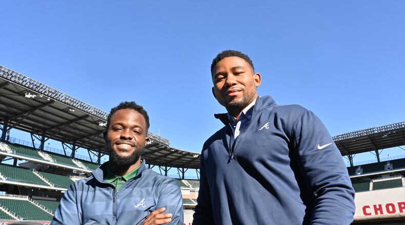 Jeremy Dorsey (left) and Terrence Pinkston -- former and current participants, respectively, in the Braves' "Bill Lucas Fellowship" program, at Truist Park on Wednesday. (Hyosub Shin / Hyosub.Shin@ajc.com)