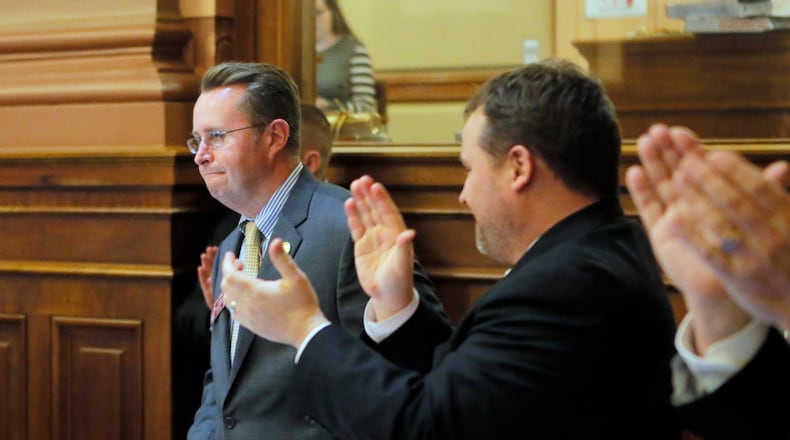 Rep. Kevin Tanner, R - Dawsonville, receives an ovation after the passage of HB 930, the mass transportation bill. BOB ANDRES /BANDRES@AJC.COM