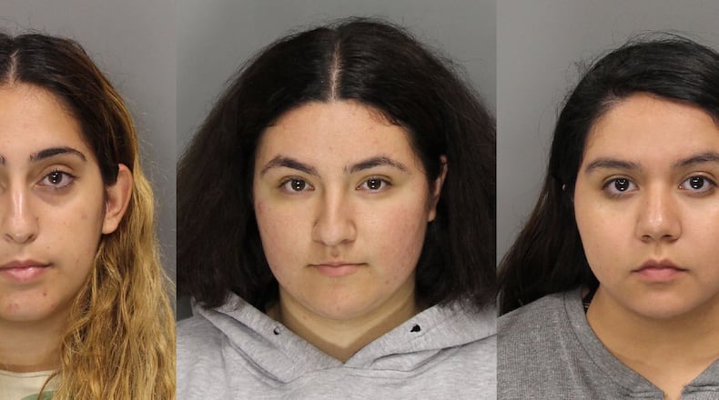 From left to right are Israa Mohamedeh Ayyad, Lytzy Herrea and Noemi Ramirez, who are charged with felony theft by deception. Credit: Cobb County Sheriff’s Office