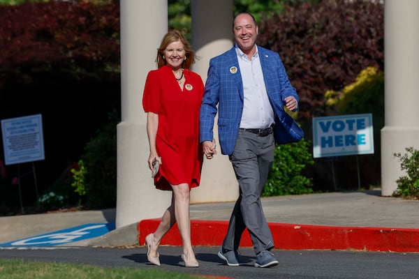 Attorney General Chris Carr (right) smiles with his wife, Joan Carr, after casting his vote during the first day of early voting Monday for Georgia's primary elections. (Miguel Martinez/AJC)
