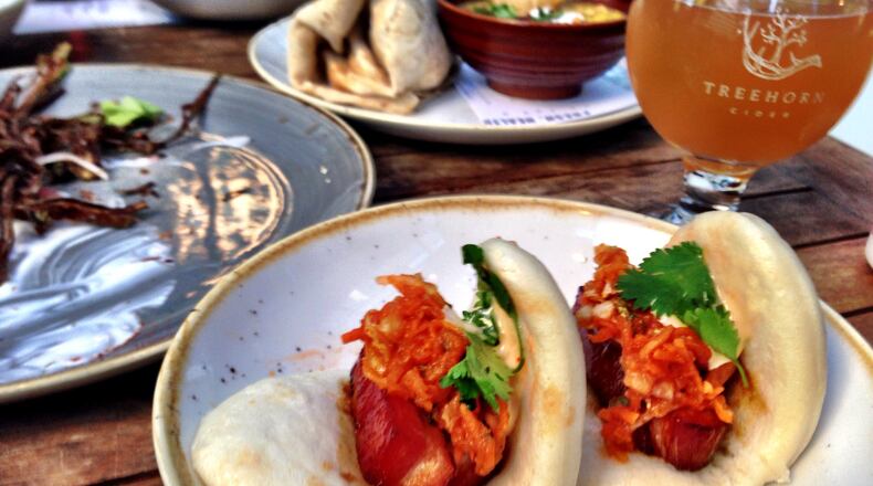 Tyler Williams’ menu takes influences from all over the map, including these steamed pork belly buns. (Wyatt Williams)