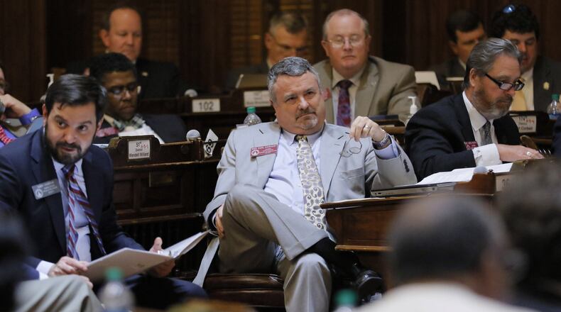 State Rep. Earl Ehrhart (center), R-Powder Springs, during the legislative session that ended last week. BOB ANDRES /BANDRES@AJC.COM