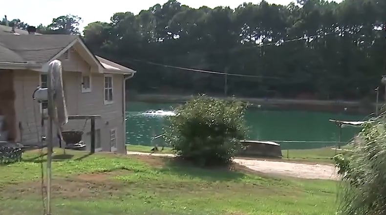 A father allegedly killed his son at a popular fishing spot run by the family in Newton County on Friday night, police said.