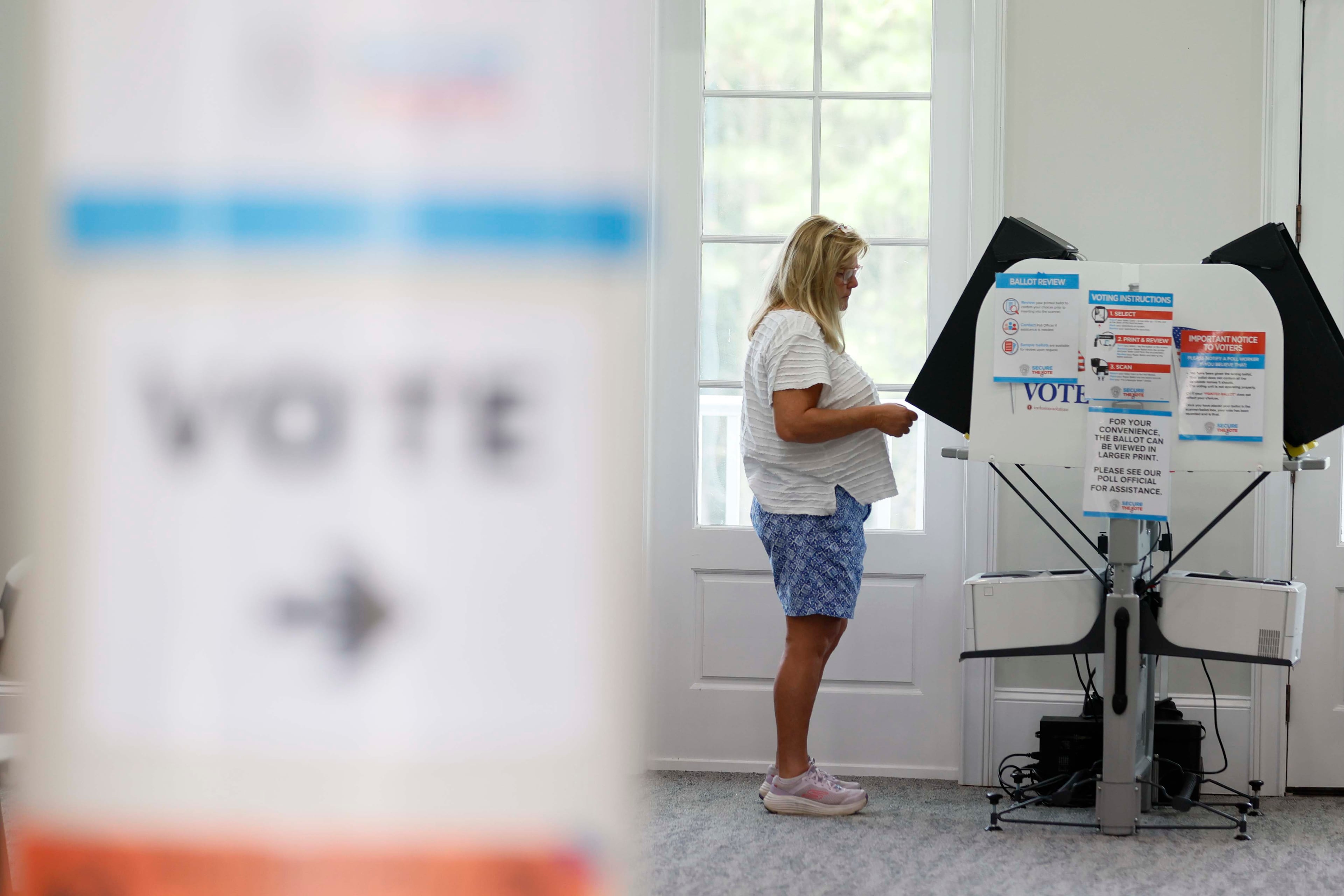 Holly Ricketts of Canton is seen casting her ballot at the River-Green subdivision in Canton during the special election for the state senate seat in Cherokee on Tuesday, August 26, 2025, to complete former state Sen. Brandon Beach’s term, which runs through January 2027. (Miguel Martinez/ AJC)