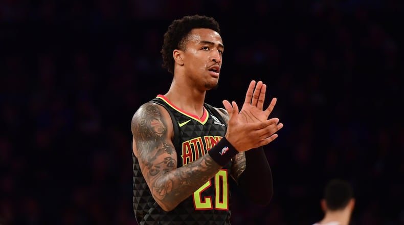 John Collins of the Atlanta Hawks claps during the third quarter of the game against New York Knicks at Madison Square Garden on December 21, 2018 in New York City.