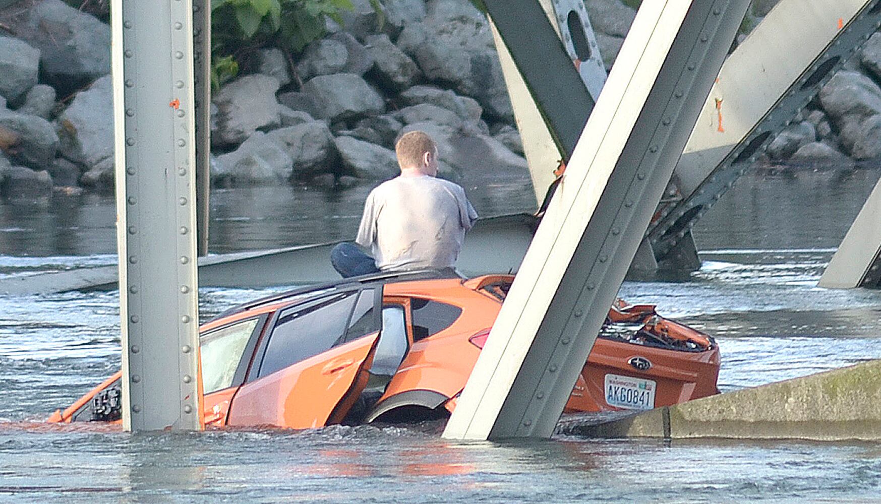 Vehicles, people dumped into water