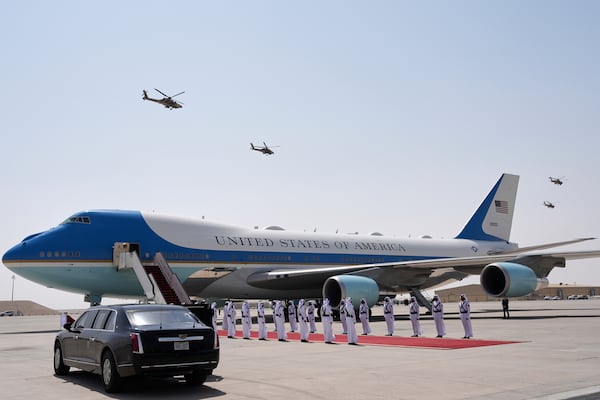 Qatar Air Force Apache gunships perform a flyover as Air Force One is ready to depart from Al Udeid Air Base, Thursday, May 15, 2025, in Doha, Qatar. (AP Photo/Alex Brandon)