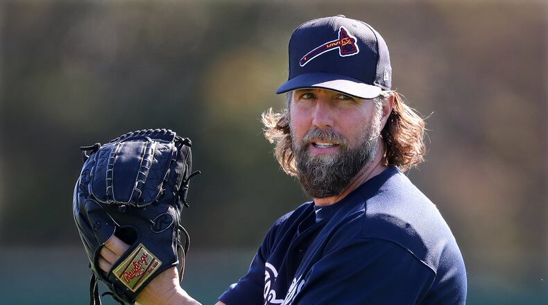 Braves knuckleballer R.A. Dickey, pictured during an early spring-training workout, gave up five runs (two earned) and five hits in three innings of his second start Saturday against the Marlins. (Curtis Compton/ccompton@ajc.com)