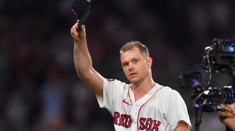 Boston Red Sox's Sonny Gray tips his hat to the crowd as he exits the game after giving up a hit in the eighth inning after pitching seven innings without a hit against the New York Yankees in a baseball game, Sunday, June 28, 2026, in Boston. (AP Photo/Steven Senne)