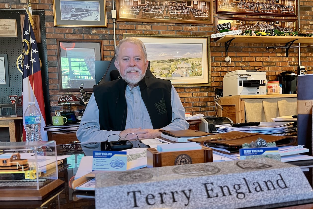 Former state Rep. Terry England sits behind his desk from the state Capitol at his home office in his Auburn, Ga, on Nov. 19, 2025. (Patricia Murphy/AJC)