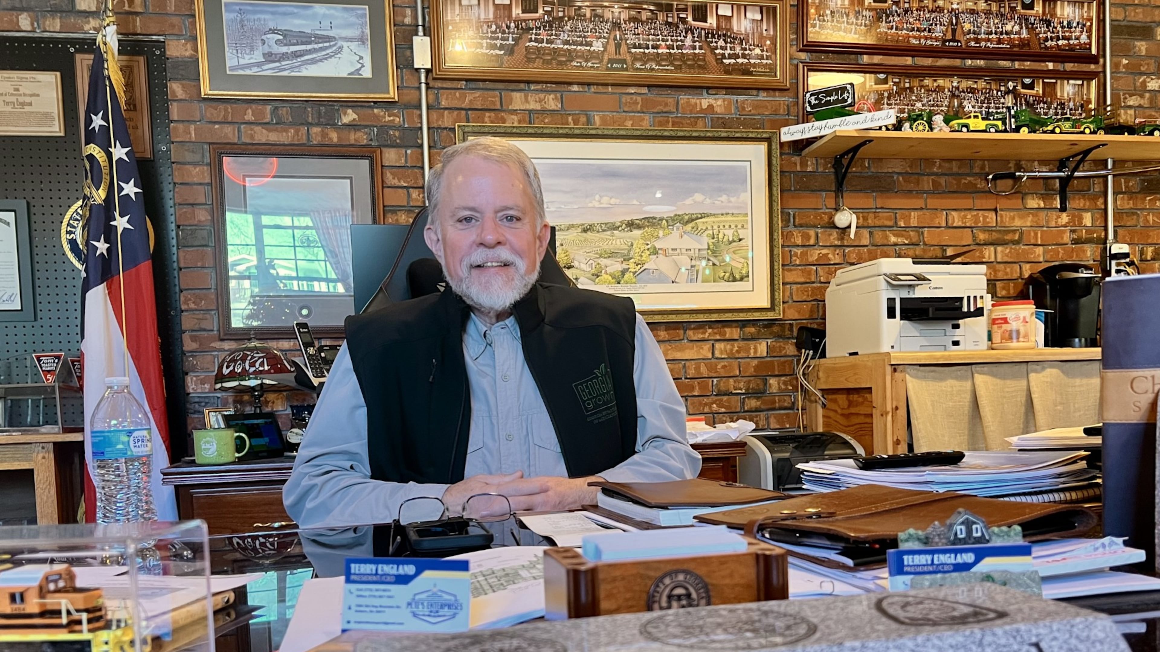 Former state Rep. Terry England sits behind his desk from the state Capitol at his home office in his Auburn, Ga, on Nov. 19, 2025. (Patricia Murphy/AJC)