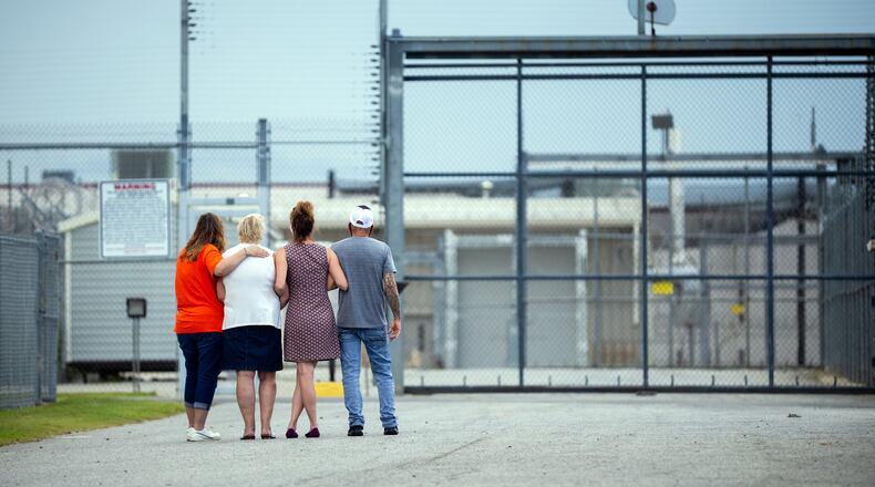 Friends and family of an inmate about to be released wait for him outside the gate of the Coffee Correctional Facility. The state NAACP has sued the prison alleging inhumane conditions. (Stephen B. Morton/Atlanta Journal-Constitution/TNS)