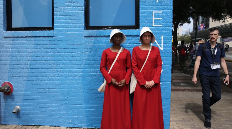 Cosplayers from the television series "The Handmaid's Tale" are seen during 2017 SXSW Conference and Festivals on March 10, 2017, in Austin, Texas.