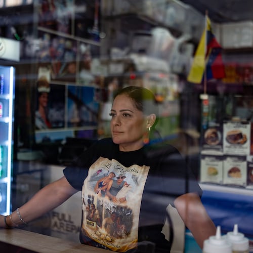 Kelly Granado, whose parents died in Venezuela's June 24 earthquakes, poses for photos at her restaurant in downtown Los Angeles, Tuesday, Aug. 25, 2026. (AP Photo/Jae C. Hong)