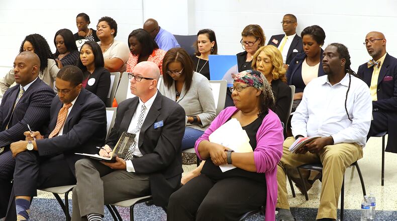 Two dozen candidates for the Atlanta Board of Education gather to participate in an election forum at the IBEW Auditorium on Tuesday.    Curtis Compton/ccompton@ajc.com