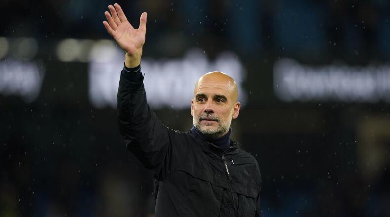 Manchester City's head coach Pep Guardiola greets fans at the end of the English Premier League soccer match between Manchester City and Crystal Palace in Manchester, England, Wednesday, May 13, 2026. (AP Photo/Ian Hodgson)