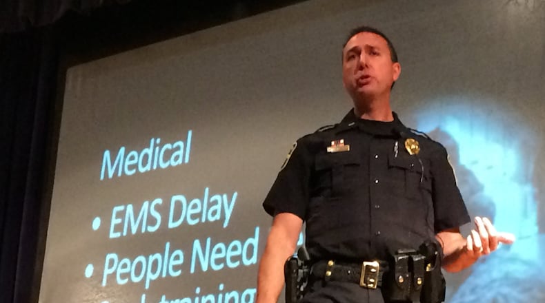 Lt. Brian Marshall of the Marietta Police Department addresses a crowd at Marietta Middle School. The department hosted a second seminar on how to react in an active shooting. MARK DAVIS/MRDAVIS@AJC.COM