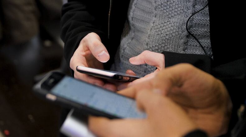The California State Teachers Retirement System and JANA Partners are urging Apple to help study the effects of smartphone use on children. (Media Whale/Dreamstime/TNS)