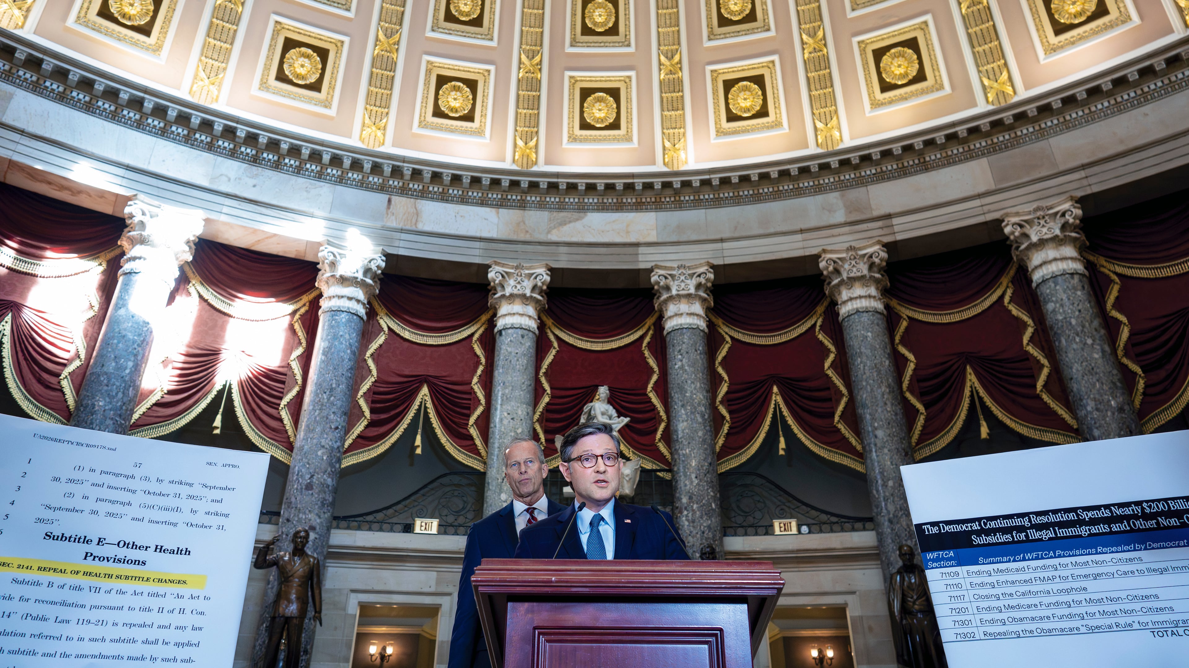 Speaker of the House Mike Johnson, R-La., and Senate Majority Leader John Thune, R-S.D., left, talk with reporters in Statuary Hall on the third day of the government shutdown, at the Capitol in Washington, Friday, Oct. 3, 2025. (AP Photo/J. Scott Applewhite)