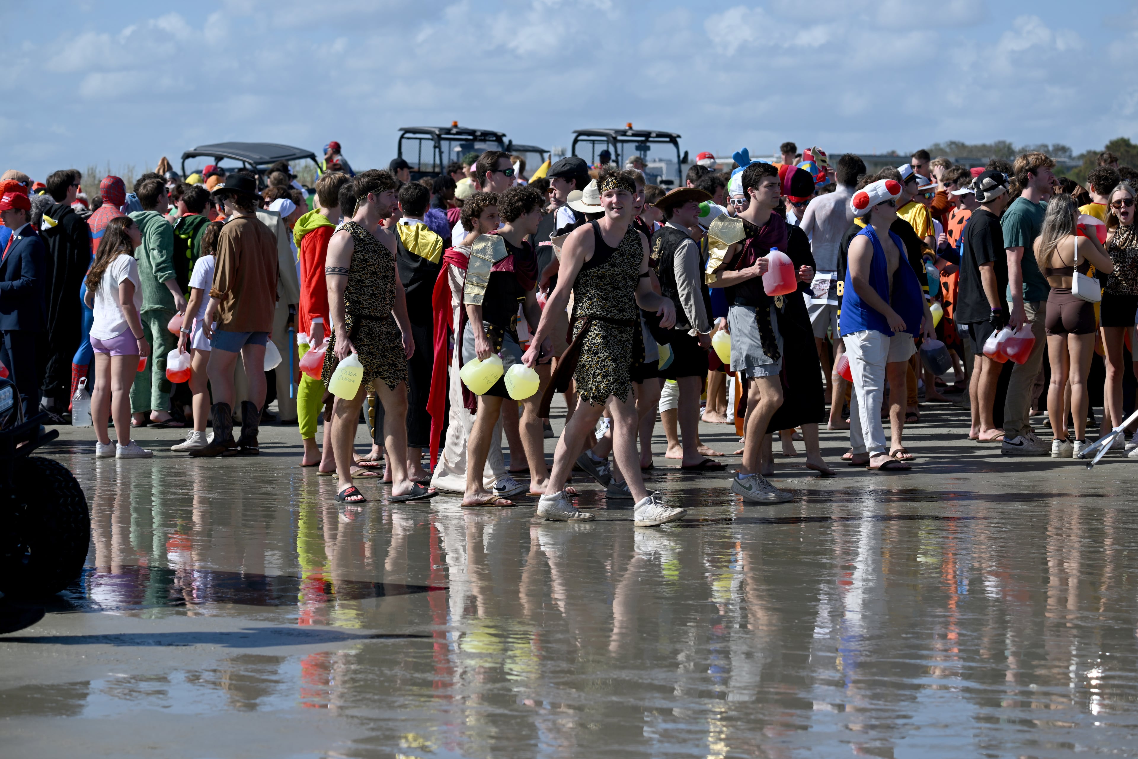 Thousands of UGA students gather during the annual “Frat Beach” party for the weekend of the Georgia-Florida football game on St. Simons Island, Friday, November 1, 2024. On the weekend of the Georgia-Florida football game, St. Simons Island’s East Beach becomes “Frat Beach,” an open-air party teeming with thousands of college students. (Hyosub Shin / AJC)
