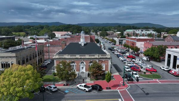 This aerial image shows the Carpet and Rug Institute building in downtown Dalton. The region’s carpet mills began attracting a growing Latino workforce in the 1980s. (Miguel Martinez/AJC 2025)