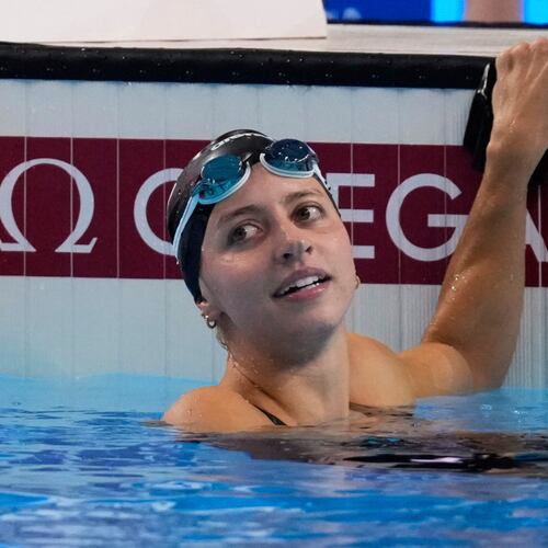 FILE -Kate Douglass of the United States reacts after winning gold medal in the women's 200-meter breaststroke final at the World Aquatics Championships in Singapore, Friday, Aug.1, 2025. (AP Photo/Vincent Thian, File)