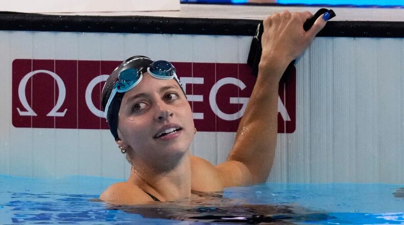 FILE -Kate Douglass of the United States reacts after winning gold medal in the women's 200-meter breaststroke final at the World Aquatics Championships in Singapore, Friday, Aug.1, 2025. (AP Photo/Vincent Thian, File)