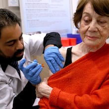 Dr. Gaurav Shinde (left) gives Giti Noroozi, 85, vaccinations for COVID and the flu at a California pharmacy in 2024. It is recommended that older adults get flu shots, as they are at a higher risk for hospitalization or death from the flu. (Genaro Molina/TNS 2024)