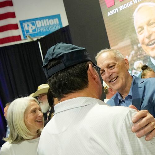 Arizona Republican gubernatorial candidate U.S. Rep. Andy Biggs, right, greets a supporter after being declared the winner in the primary, Tuesday, July 21, 2026, in Scottsdale, Ariz. (AP Photo/Ross D. Franklin)
