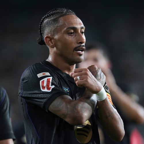 Barcelona's Raphinha celebrates after scoring his side's third goal during a Spanish La Liga soccer match between Elche and Barcelona in Elche, Spain, Sunday, Aug. 23, 2026. (AP Photo/Alberto Saiz)