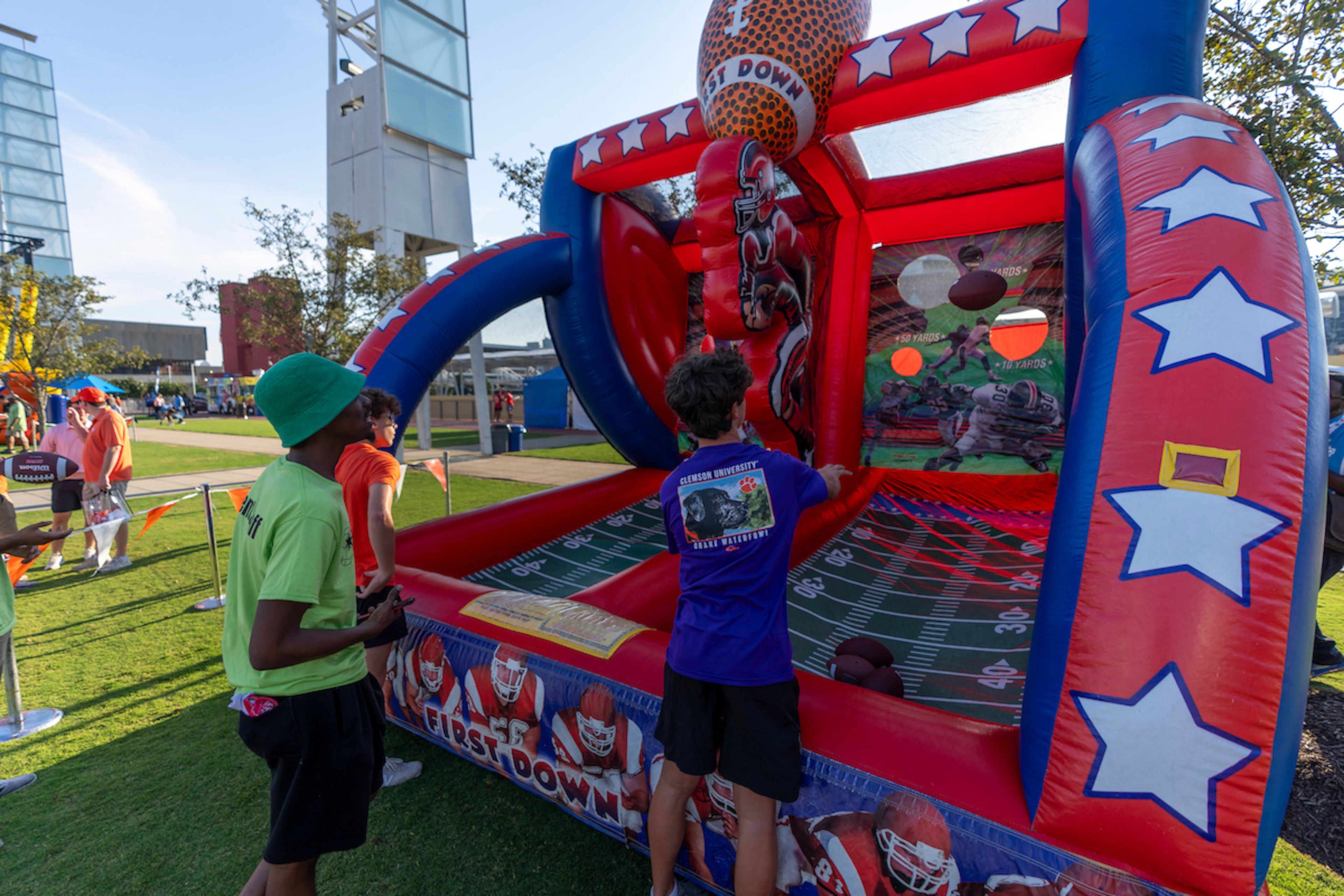 Children play a toss challenge at 2024's Tailgate Town on Saturday, August 31, 2024. (Erik Rank/Abell Images)