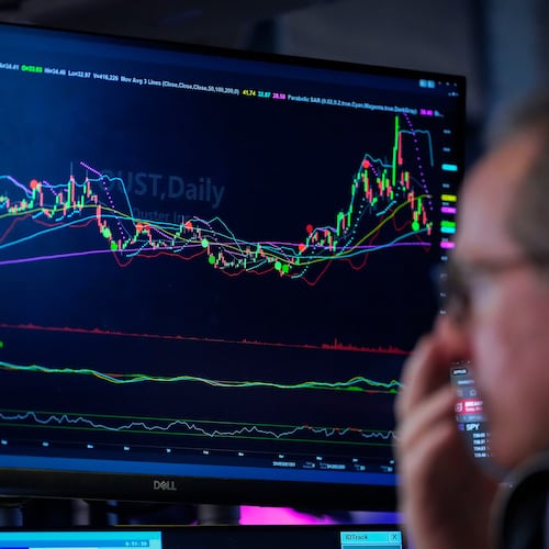 A trader works on the floor of the New York Stock Exchange, Thursday, July 30, 2026, in New York. (AP Photo/Yuki Iwamura)