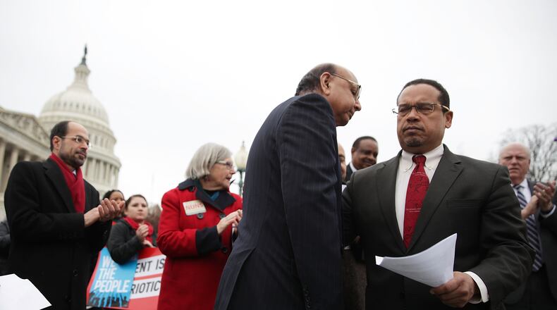 U.S. Rep. Keith Ellison, D-Minn., right, greets Gold Star father Khizr Khan in front of the Capitol earlier this month. Ellison is one of several candidates for chairman of the Democratic National Committee. Alex Wong/Getty Images