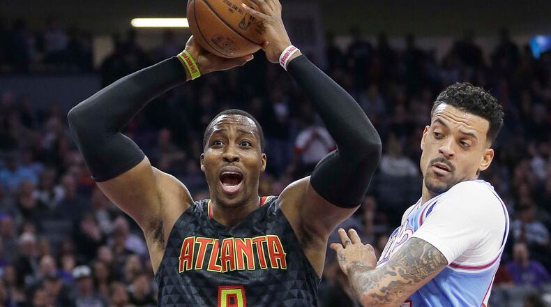Atlanta Hawks center Dwight Howard, left, reacts after being called for a foul during the first half of the team’s NBA basketball game against the Sacramento Kings on Friday, Feb. 10, 2017, in Sacramento, Calif. (AP Photo/Rich Pedroncelli)