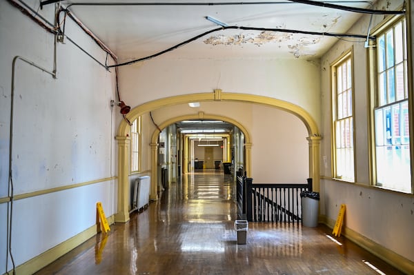 The second-floor hallway of the historic SCCPSS Central Office building on Bull Street in Savannah, Ga., features historic archways. (Sarah Peacock for The Atlanta Journal Constitution) 