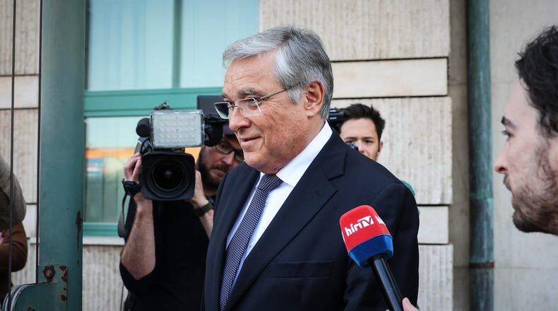 FILE - Russia's ambassador to Hungary, Evgeny Stanislavov, is surrounded by media as he leaves the Hungarian Foreign Ministry building, in Budapest, Thursday, May 14, 2026. (AP Photo, File)