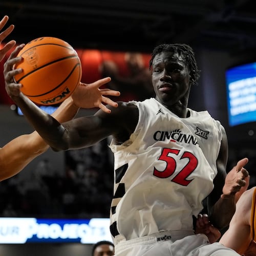 Iowa State Cyclones Joshua Jefferson (5) and Cincinnati center Moustapha Thiam (52) battle for a rebound during the first half of an NCAA college basketball game, Saturday, Jan. 17, 2026, in Cincinnati. (AP Photo/Carolyn Kaster)