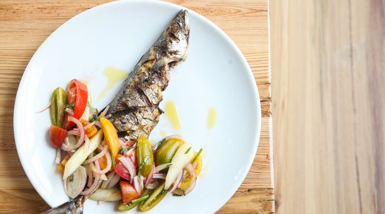 Grilled mackeral with tomato, cucumber, red onion and herbs. (styling by Chef Angus Brown ) (Photography by Renee Brock/Special)