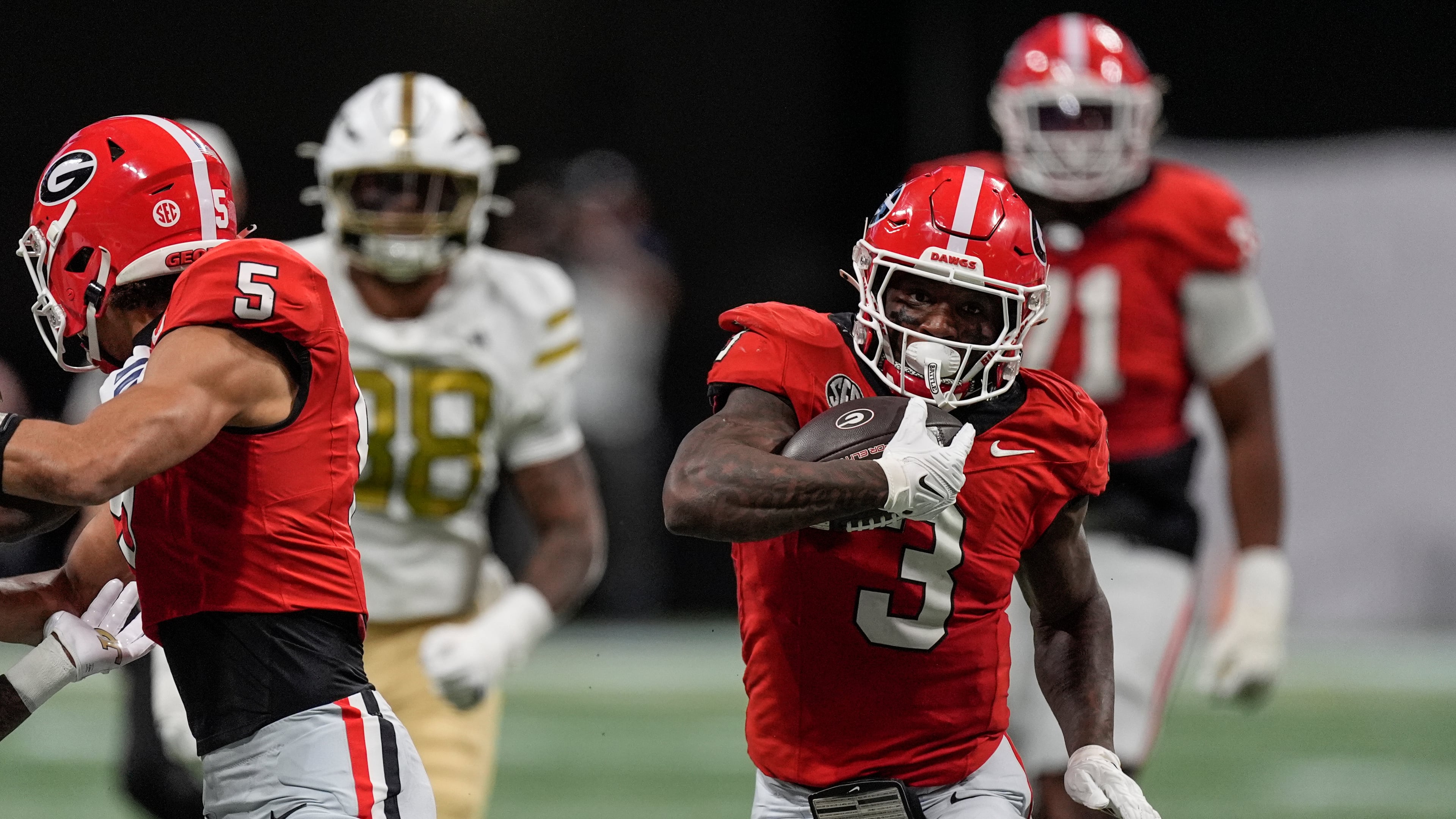 Georgia running back Nate Frazier (3) runs against Georgia Tech during the first half of an NCAA college football game, Friday, Nov. 28, 2025, in Atlanta. (AP Photo/Mike Stewart)