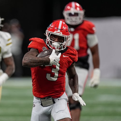 Georgia running back Nate Frazier (3) runs against Georgia Tech during the first half of an NCAA college football game, Friday, Nov. 28, 2025, in Atlanta. (AP Photo/Mike Stewart)