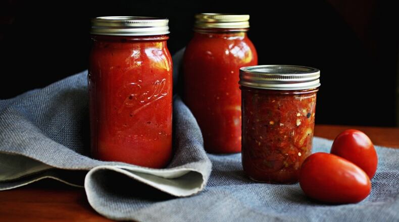 Oven-Roasted Marinara, Charred Tomato and Chile Salsa and Bottled Whole Tomatoes are just some of the ways to "put up" tomatoes in this rush of tomato season. (Juli Leonard/Raleigh News & Observer/TNS)
