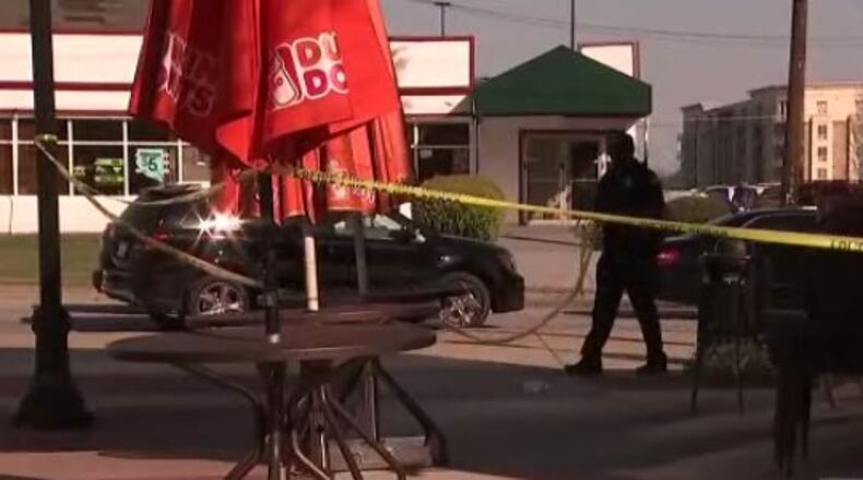A man was stabbed in the back Saturday outside a Dunkin Donuts on Piedmont Road in Atlanta. (Credit: Channel 2 Action News)