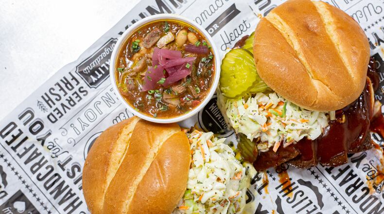 Vegan barbecue dishes prepared by chef Terry Sargent include (clockwise, from bottom left) BBQ Jackfruit Sandwich, Smoked Brunswick Stewie and Veef Brisket Sandwich. (Styling by Terry Sargent / Ryan Fleisher for the AJC)