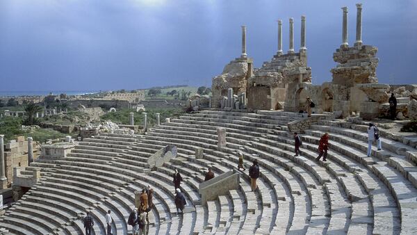 LEPTIS MAGNA, LIBYA - MAY 2000:  Tourists walk up steps of the theater's tiered seating area (cavea), which provides views of the expansive city ruins of Leptis Magna, the largest city of the ancient region of Tripolitania, May 2000 in Leptis Magna, Libya. Designated a UNESCO World Heritage site in 1982, Leptis contains some of the world's finest preserved remains of Roman architecture. (Photo by Reza/Getty Images)