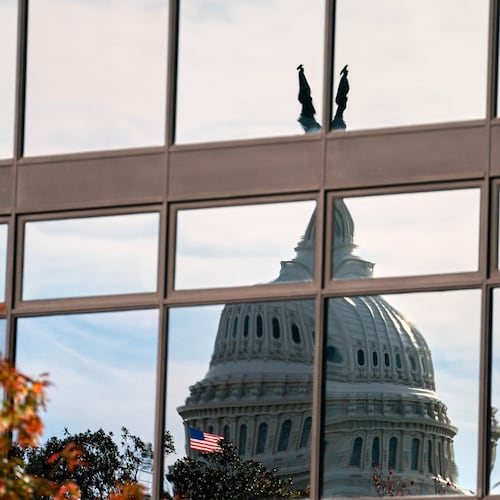 The Capitol dome is distorted by windows on the teamster's building, Tuesday, Nov. 4, 2025, in Washington. (AP Photo/Allison Robbert)