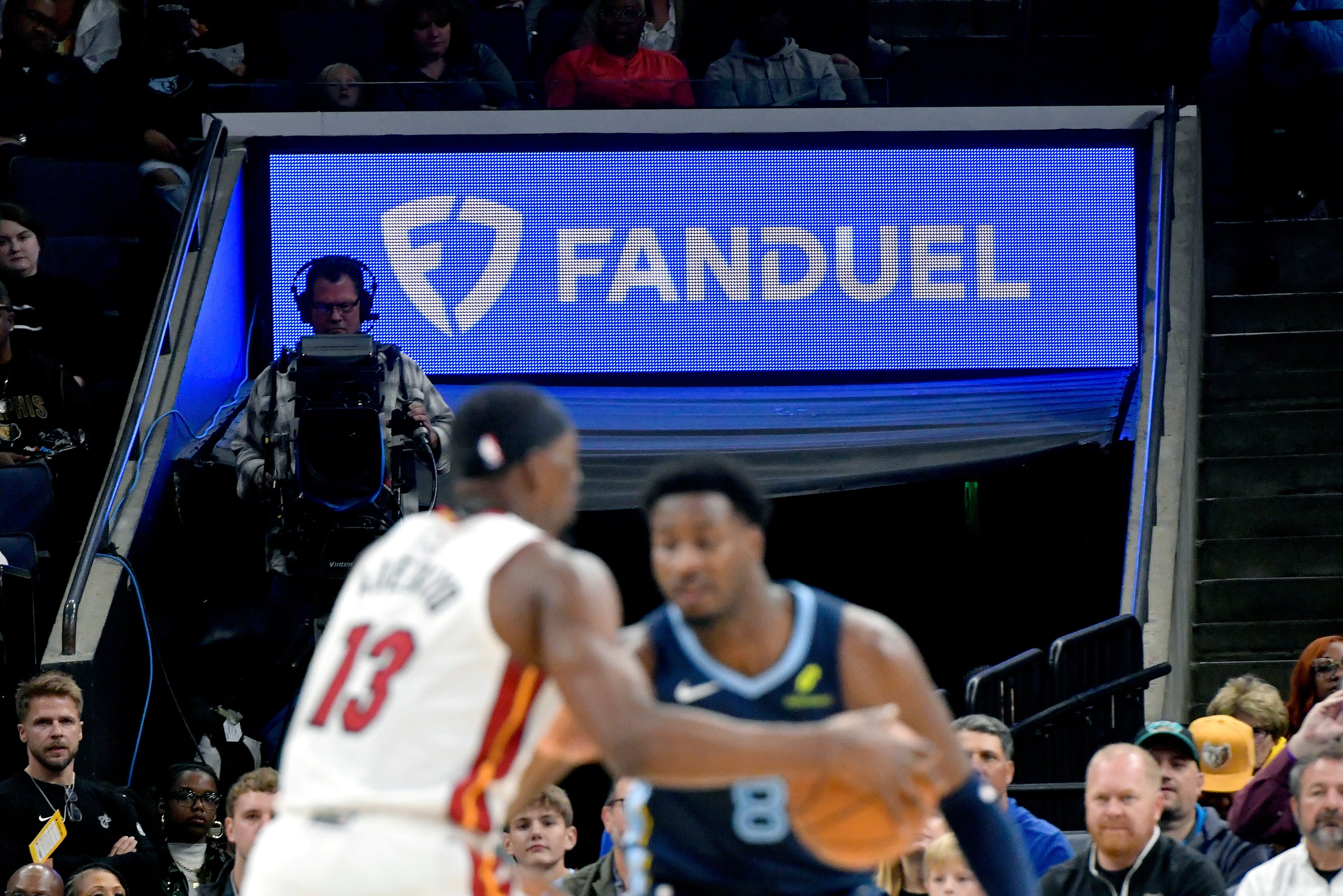 Advertisments for sports gambling companies have become omnipresent on sports podcasts and websites, as well as at games, such as this NBA game last month between the Grizzlies and Heat. (Brandon Dill/AP)