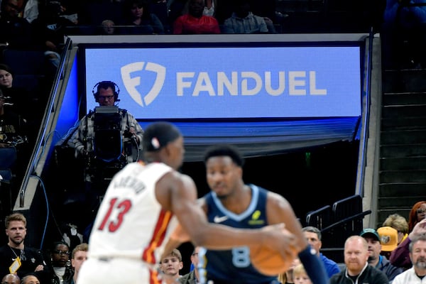 Advertisments for sports gambling companies have become omnipresent on sports podcasts and websites, as well as at games, such as this NBA game last month between the Grizzlies and Heat. (Brandon Dill/AP)
