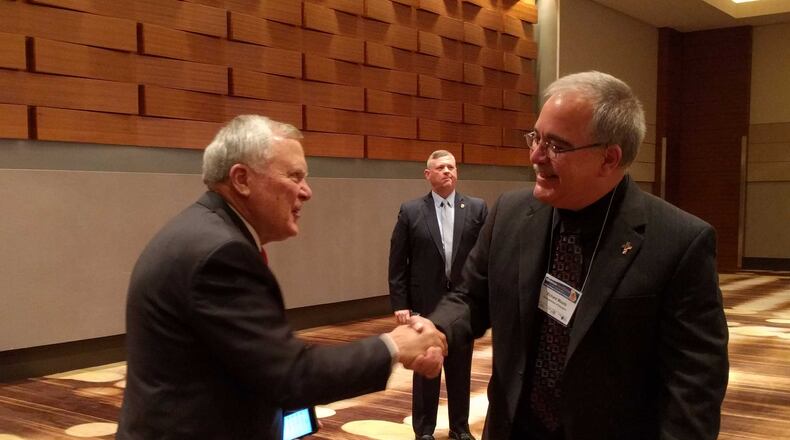 Gov. Nathan Deal and Georgia School Superintendent Richard Woods at a happier interaction than their recent exchange over the state's accountability plan. (AJC File)