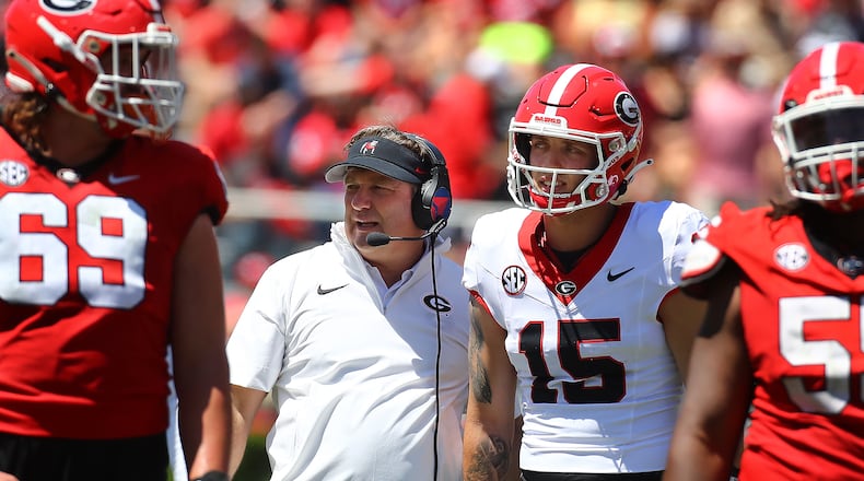 041324 Athens: Head coach Kirby Smart confers with Carson Beck between plays during the G-Day game on Saturday, April 13, 2024.  Curtis Compton for the Atlanta Journal Constitution